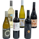 Collection of wine bottles with various labels on a white background