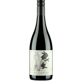 Wine bottle with a label featuring artistic design on a white background